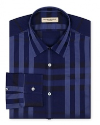 Inky blue hues lend a moody and mysterious air to a check-printed dress shirt from Burberry London.