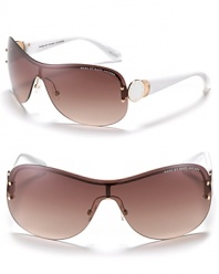 Chic shield sunglasses from MARC by MARC JACOBS are designed with classic style. With adjustable nose pads for secure comfort.