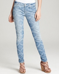 These 7 For All Mankind skinny jeans are enlivened by a faded ikat print and finished with a casually cool roll-up hem.