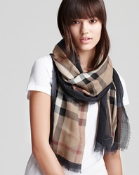 This signature Burberry scarf is the perfect way to tie up every look.