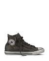 Finish off your rock 'n' roll style with classic Chuck Taylors, furnished with zippers on the side for extra edge.