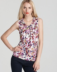 Layered florals are embellished with platinum buttons on this pleated, v neck MARC by MARC JACOBS top.