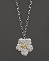 A delicate gardenia, captured at the height of its beauty in sterling silver and 18K yellow gold, blooms on this necklace from Buccellati.