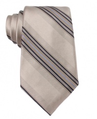 Simple and subtle. Pair this striped DKNY tie with a crisp shirt from your closet for instant sophistication.