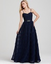 Make a grand entrance with Adrianna Papell's ruffled and rosette covered gown, dramatic in a deep navy hue.