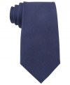 A solid statement. Score a singular look with this silk tie from Tommy Hilfiger.