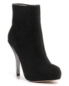 Gleaming metal heels, soft suede and a seductive shape add up to one striking pair of booties. By Jean-Michel Cazabat.
