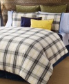 Tommy Hilfiger's Lake George duvet cover set features a classic plaid design in olive, blue and ivory tones accented with pops of yellow. Finished with blue tape binding for a clean look. Reverses to solid.