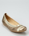 In shimmering metallic leather, these flexible ballet flats offer easily-stowable comfort and style.