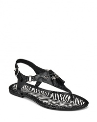 A sophisticated sandal from Sperry Top-Sider, touting leather tassels on a snakeskin-embossed design.