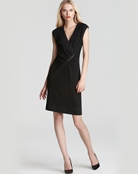A new angle on suiting, this cap-sleeve MARC BY MARC JACOBS dress features an angled zip to put a structured spin on an hourglass silhouette.