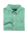 A handsome long-sleeved sport shirt is rendered in crisp gingham woven cotton broadcloth.