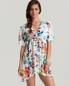 In a graphic floral print, Tommy Bahama's Beach Blossoms tunic coverup lends seaside sophistication. Hit the beach in this flowering layer for a ladylike look.